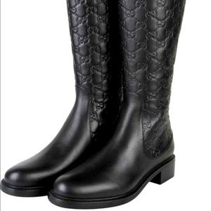 - Gucci black micro leather boots